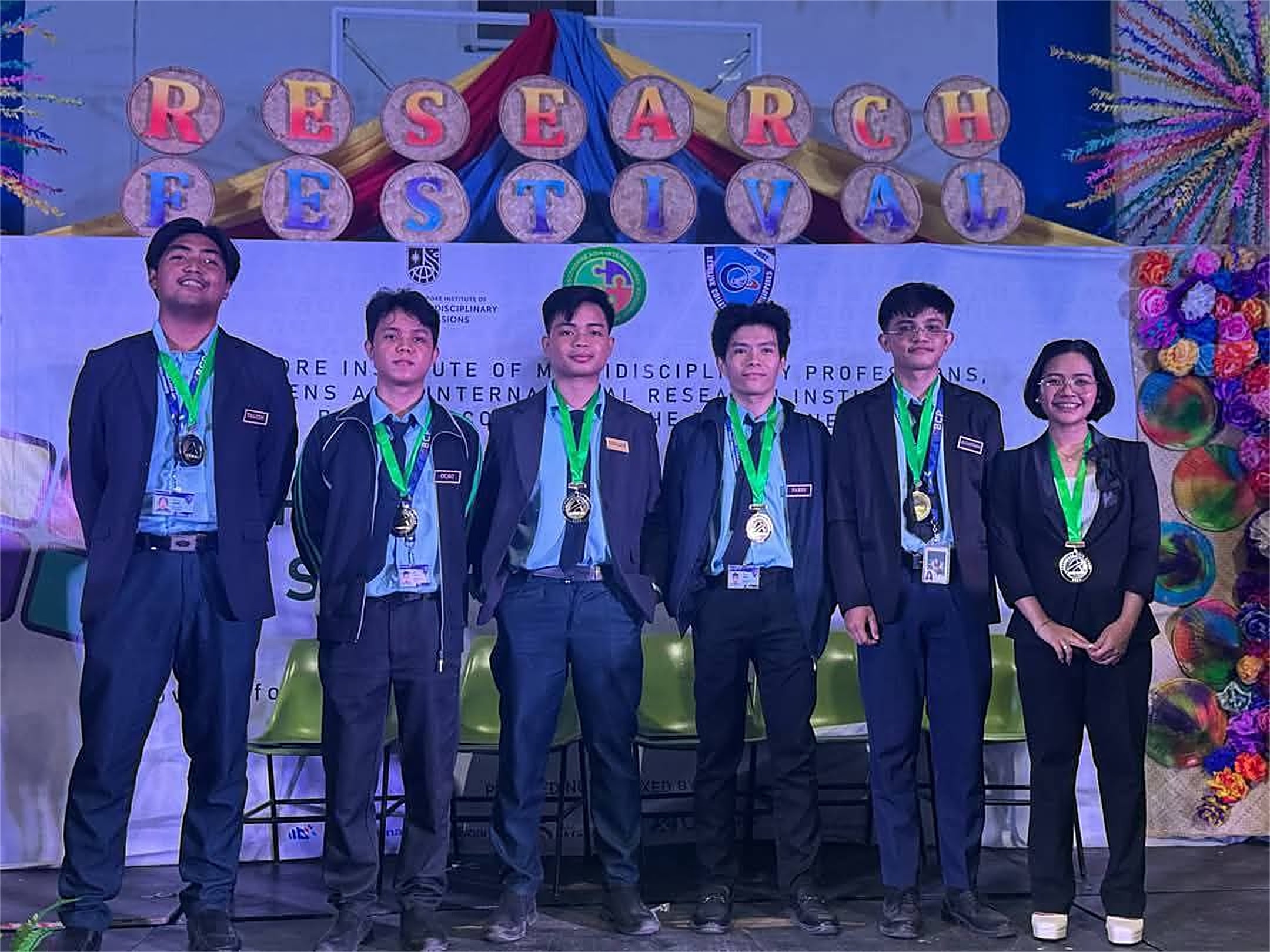 Mark and his team with their medals at the 2025 Research Festival